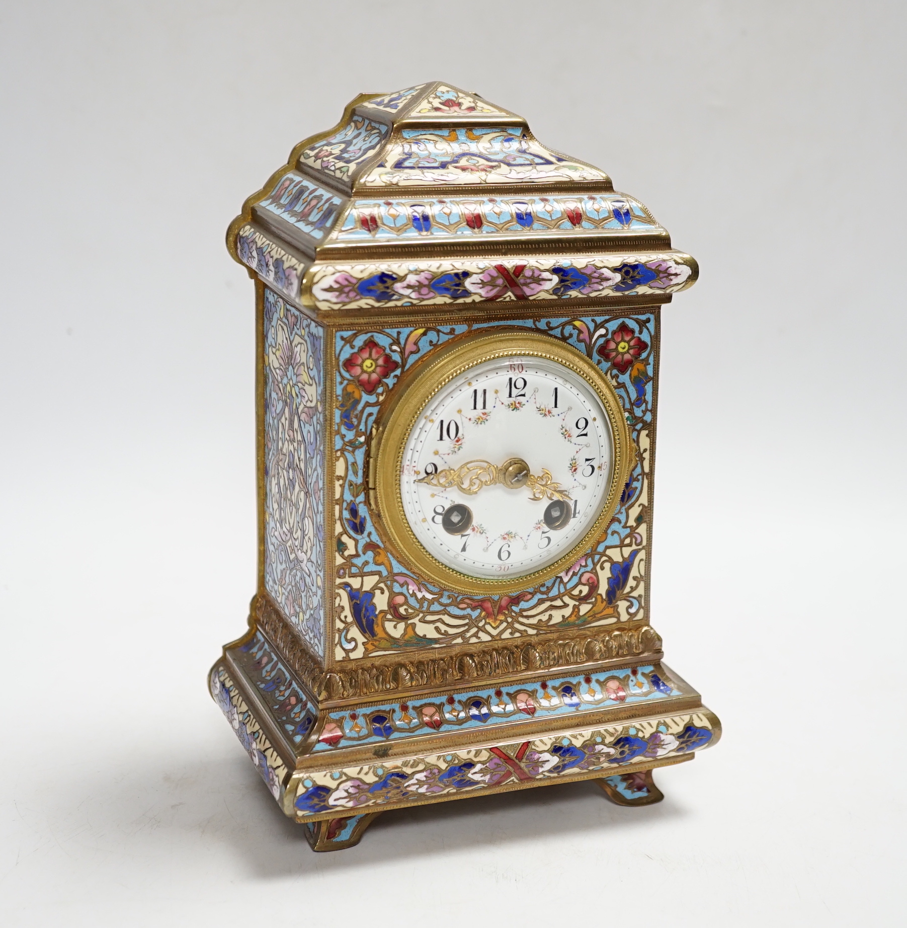 A French champlevé enamel mantel clock, 21cm